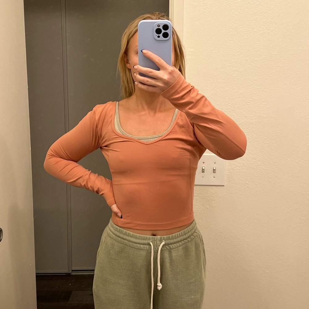 Lululemon athletic shirt, size 4. Worn once, great condition. Peach/orange.